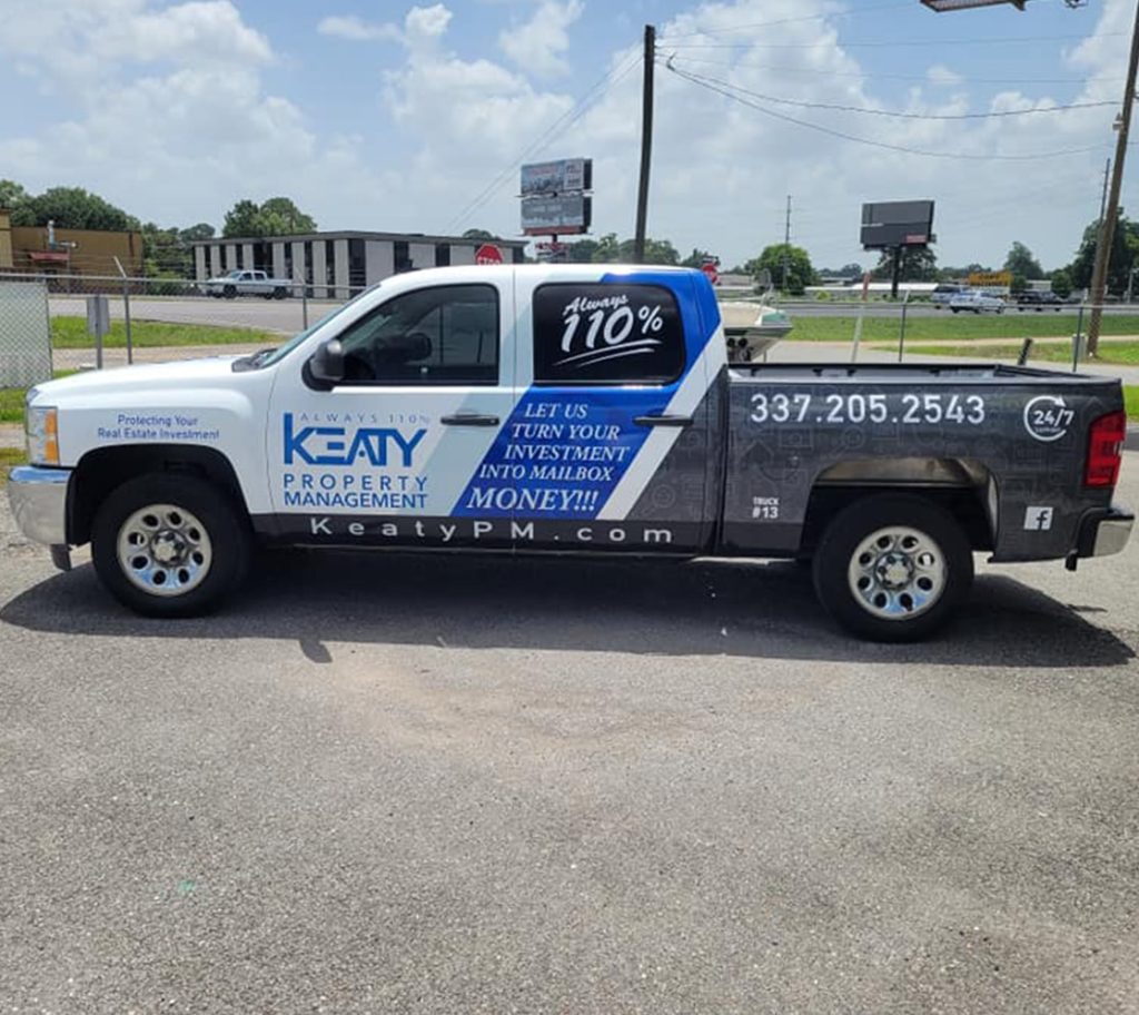 side view of Keaty Real Estate Property Management truck wrap